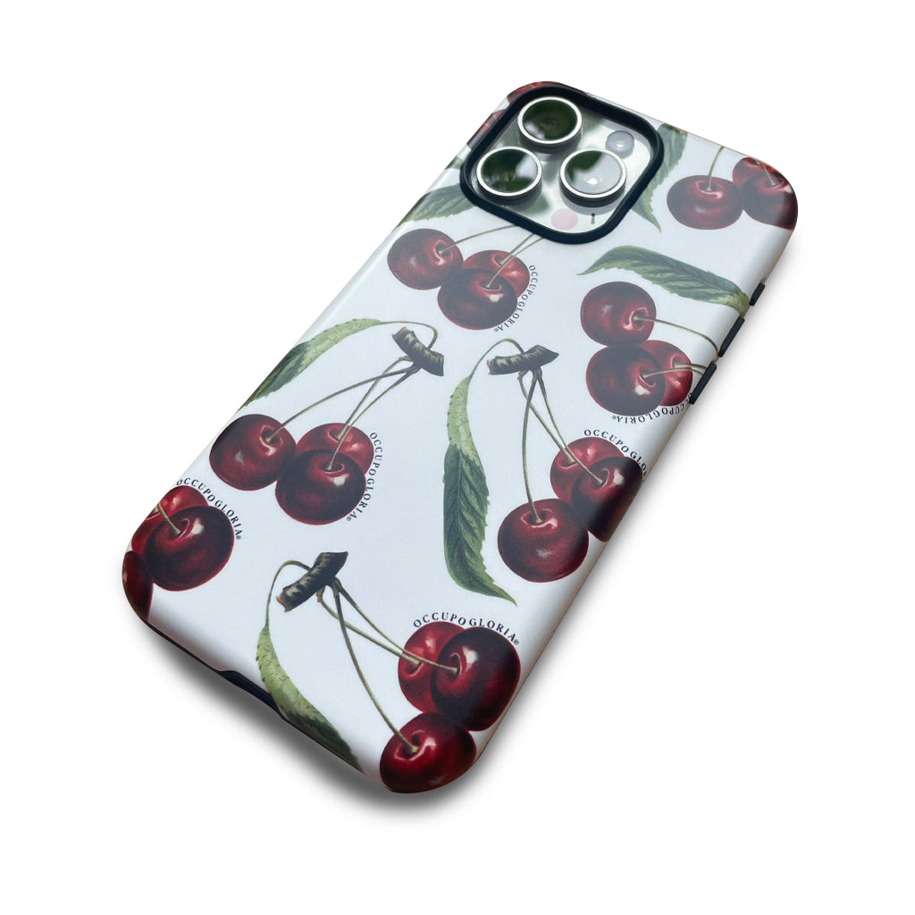 Detail view of Chérie Cherry 1890 vintage cherry iPhone case by Occupo Gloria, blending designer style with modern streetwear.