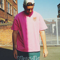 male model wearing pink t shirt washed streetwear by occupo gloria