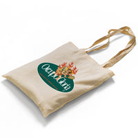 A high-quality canvas tote bag featuring the vibrant Lovestruck Rebel design. The bold print showcases a cherub with sunglasses and flames, adding a retro, rebellious vibe. The bag is photographed against a clean backdrop, highlighting its durability and stylish simplicity.