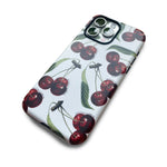 Detail view of Chérie Cherry 1890 vintage cherry iPhone case by Occupo Gloria, blending designer style with modern streetwear.
